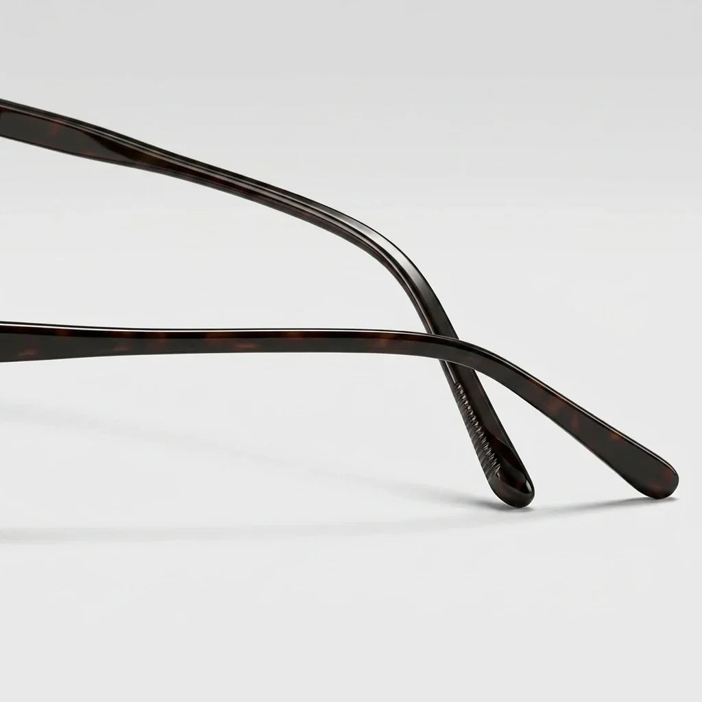 Plastic sunglasses with tinted lenses, riveted hinges, unisex fit
