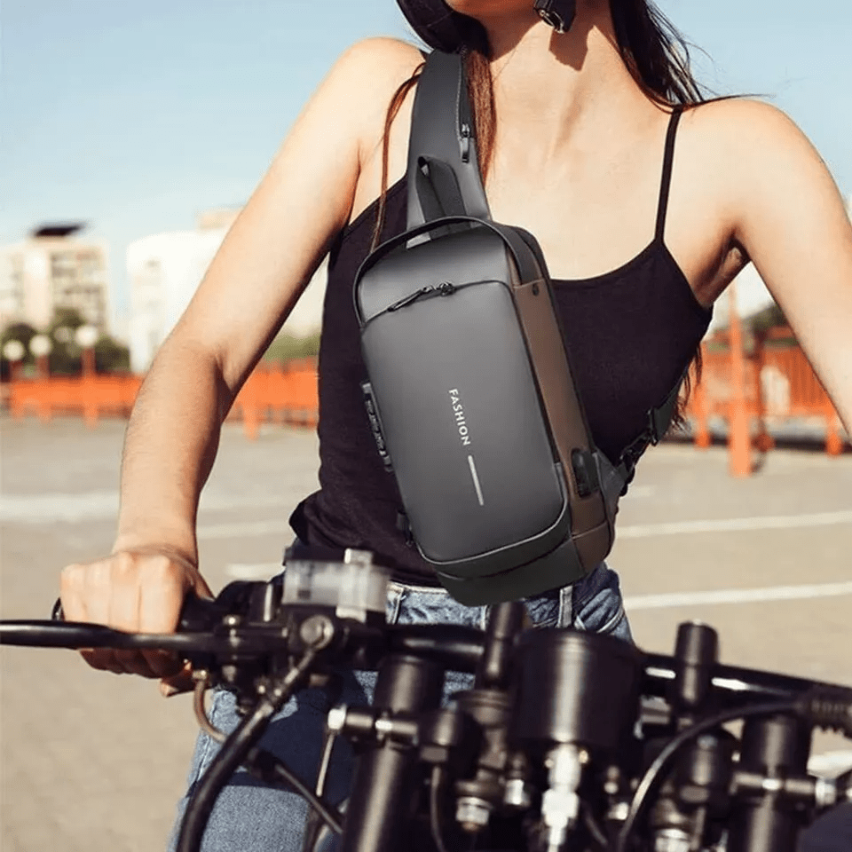 Anti - Diebstahl Crossbody - Tasche mit Zahlenschloss und USB - Ladeport Wasserabweisende Sling Bag mit Versteckten Reißverschlüssen - Bolania