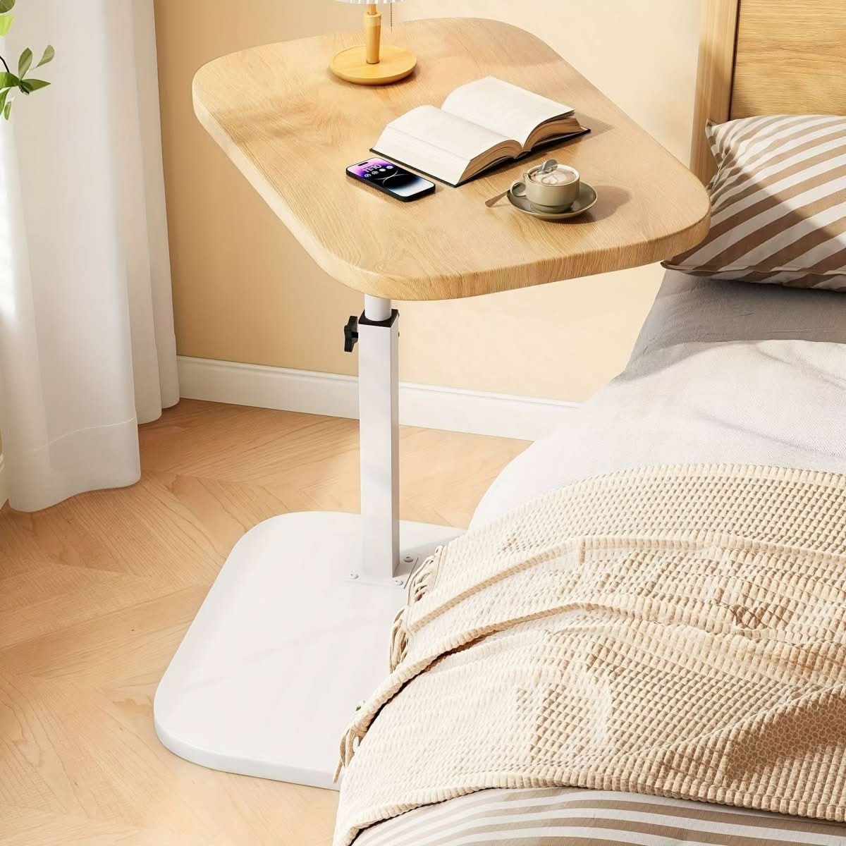 Height-adjustable side table with wooden top and metal C-shaped frame for sliding under sofas and beds for the living room